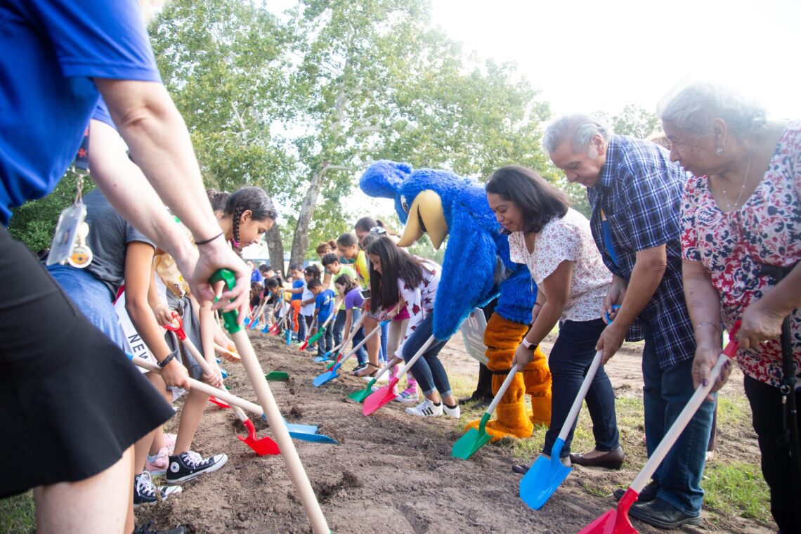 Attendees turn dirt at the Govalle groundbreaking