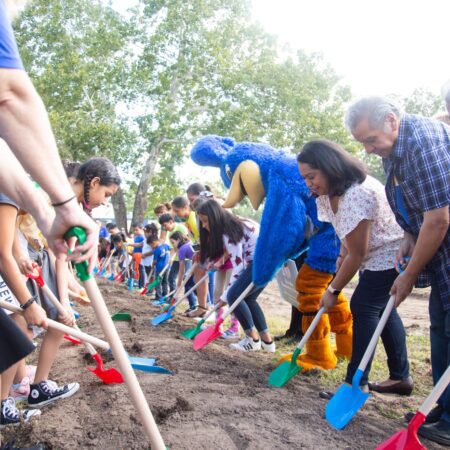 Attendees turn dirt at the Govalle groundbreaking